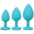 Silicone anal trainer set 3 Pc teal, featuring three varying sizes of silicone spade butt plugs for beginners.