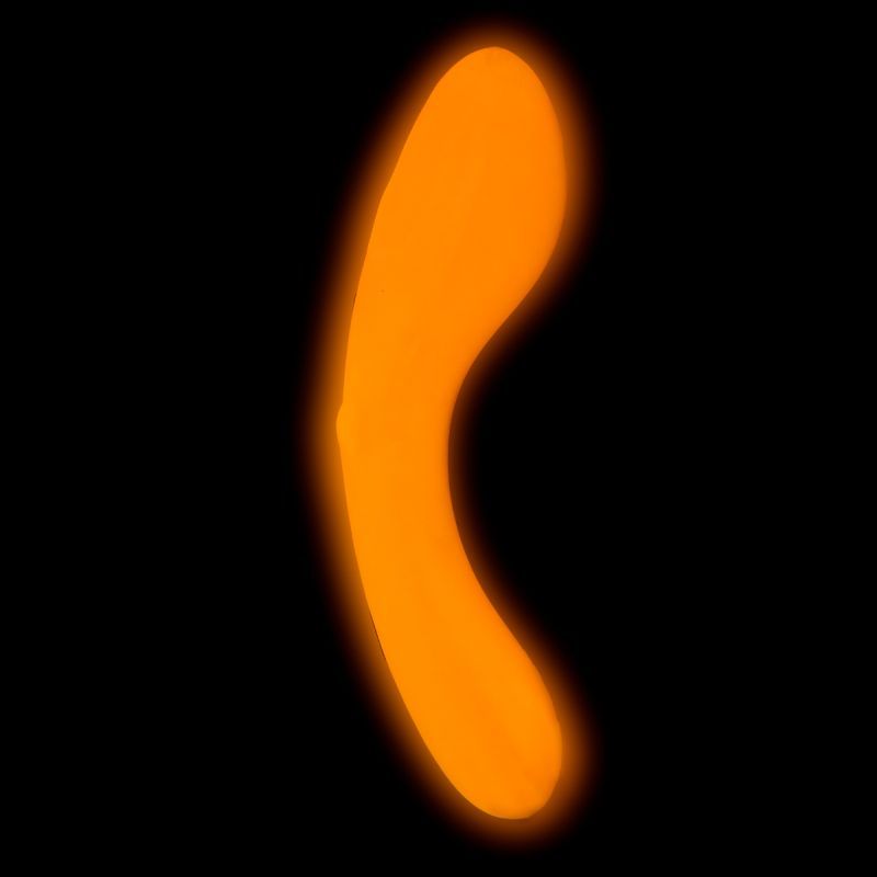 Mini Swan Wand vibrator in glowing orange color against a black background, showcasing its sleek design.