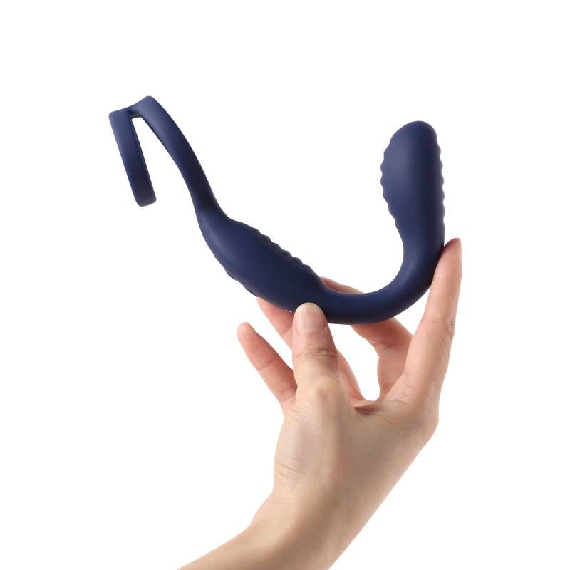 VibraDuo vibrating anal probe and cockring being held, showcasing its ergonomic design and premium silicone material.