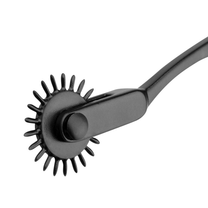 Close-up of a black Wartenberg pinwheel, showcasing its aluminum material and stimulating wheel design.