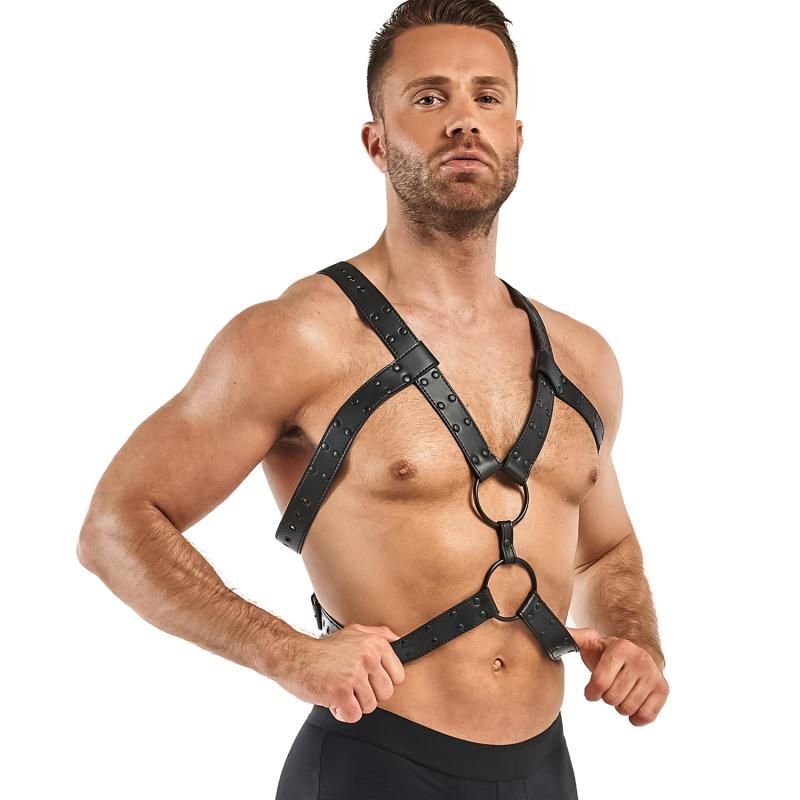 A man modeling an adjustable bondage harness black, made of faux leather for BDSM adventures.
