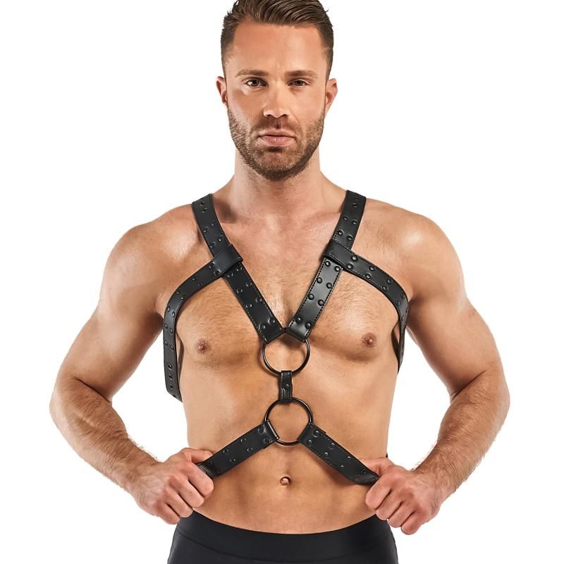 Man wearing an adjustable bondage harness in black faux leather, showcasing durability and adjustability for BDSM experiences.