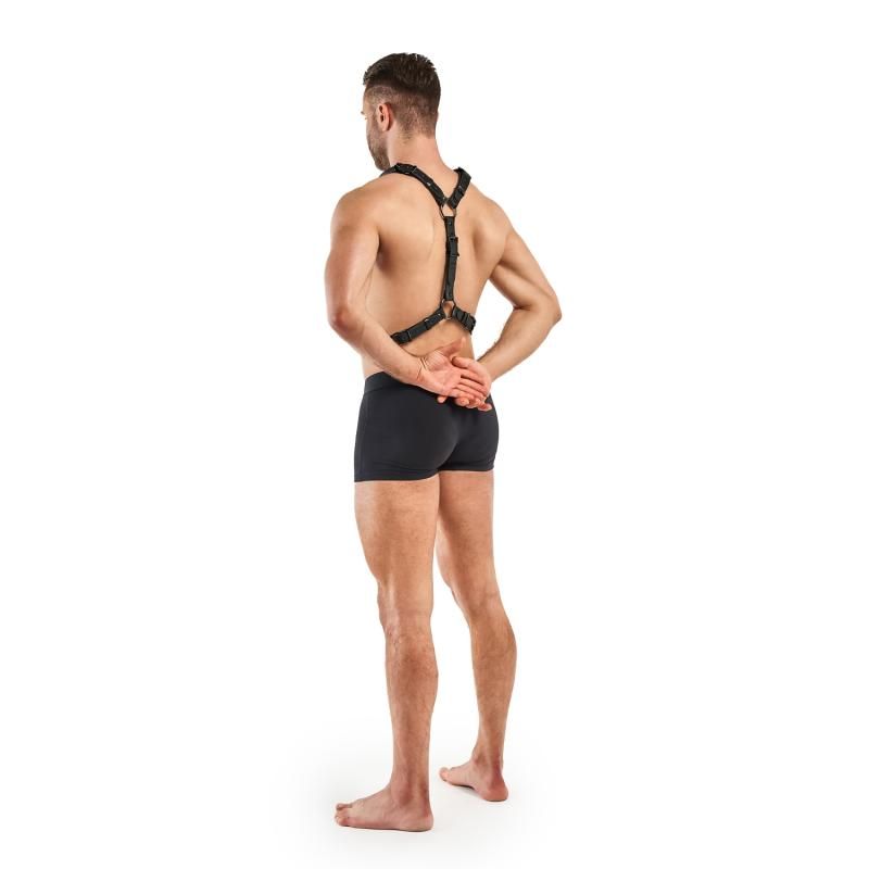 Man wearing an adjustable BDSM harness black, showcasing adjustable fit and durable design from the back.