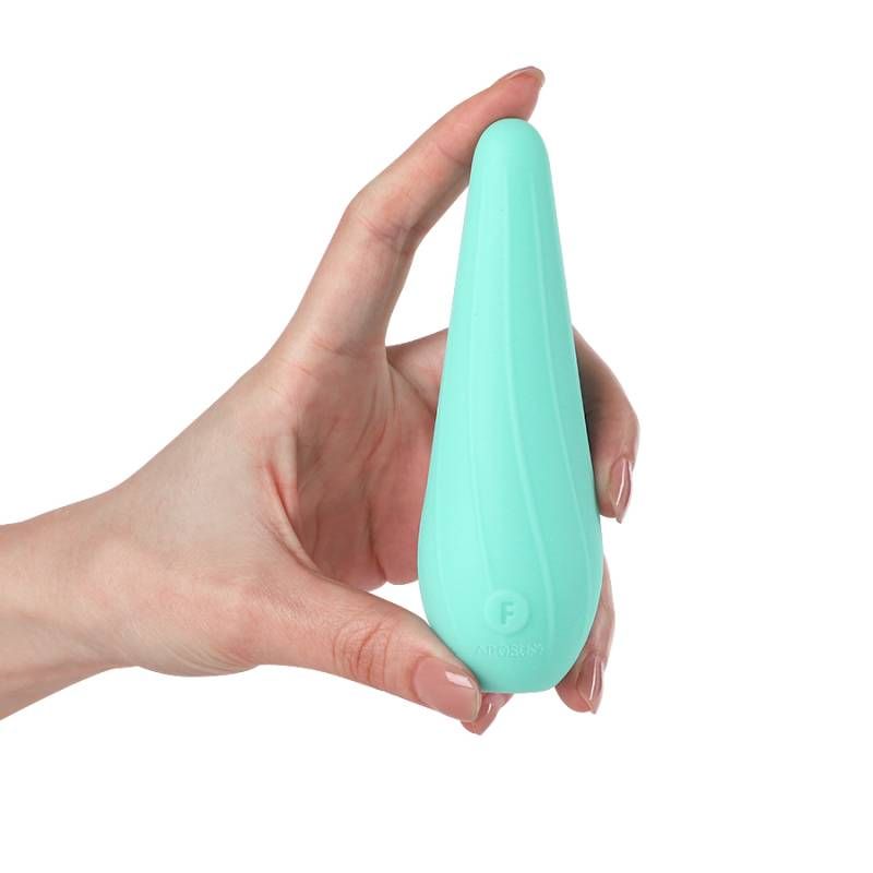 Hand holding the VibeSwirl Drip Shape Rechargeable Vibrator, a flexible and palm-sized rechargeable clitoral vibrator.