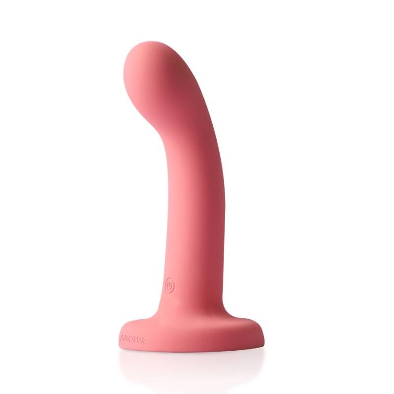 FlexDong vibrating strap-on dildo in soft pink silicone, designed for intense stimulation and curved for comfort.