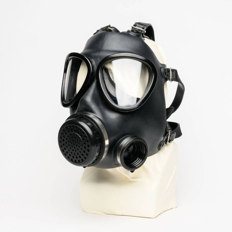 Military Adjustable Strap Rubber Gas Mask displayed on a white mannequin, featuring adjustable straps for a custom fit.