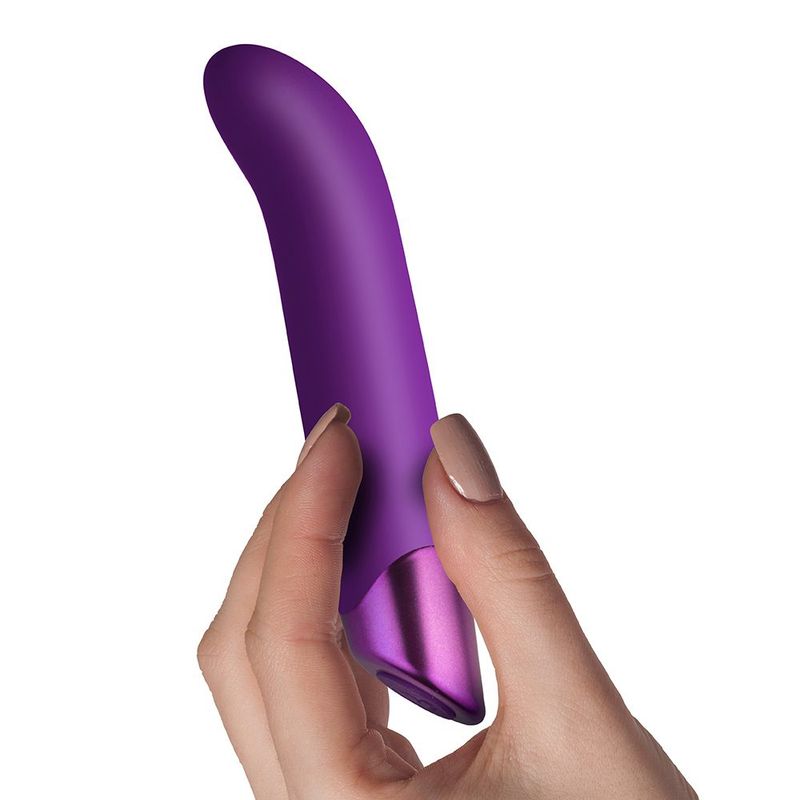 Chaiamo G Purple, a sleek G spot vibrator with multiple settings held in hand, showcasing its ergonomic design.