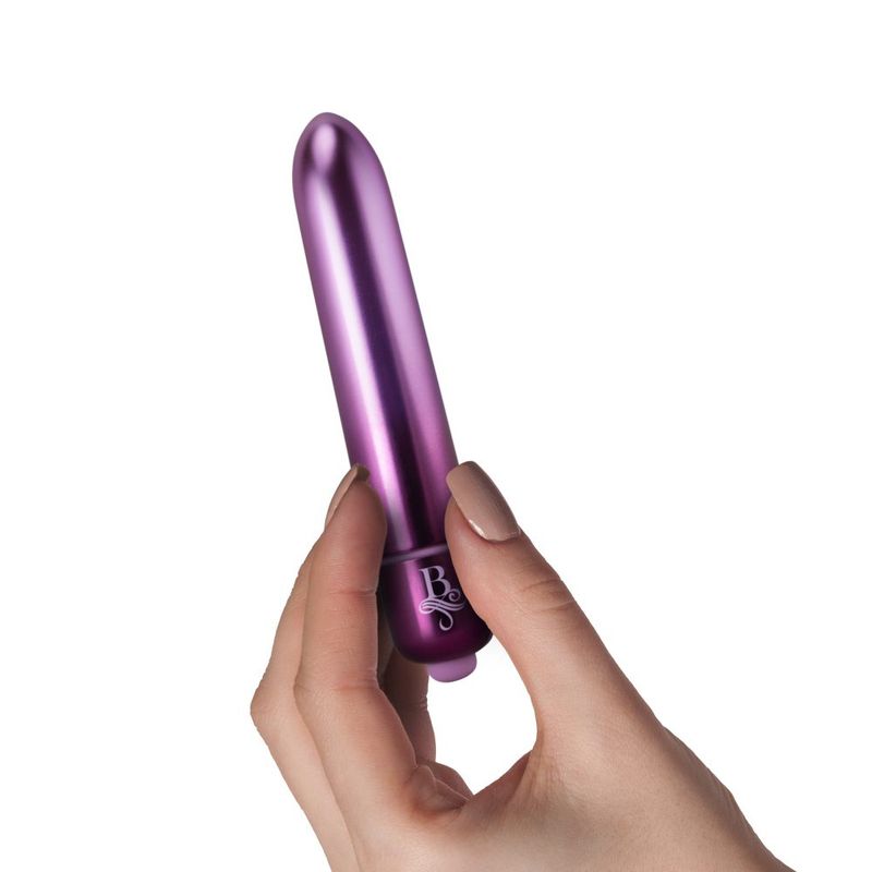Boudoir Parlour Prince Bullet waterproof bullet vibrator held in hand, showcasing its sleek design and vibrant finish.