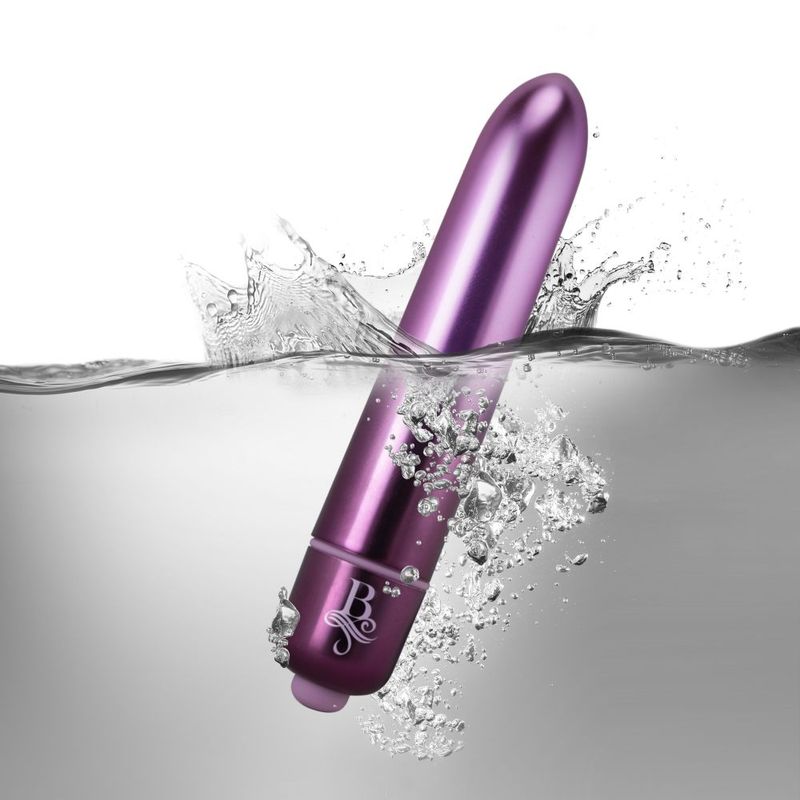 Purple waterproof bullet vibrator submerged in water, showcasing its powerful design and sleek finish.