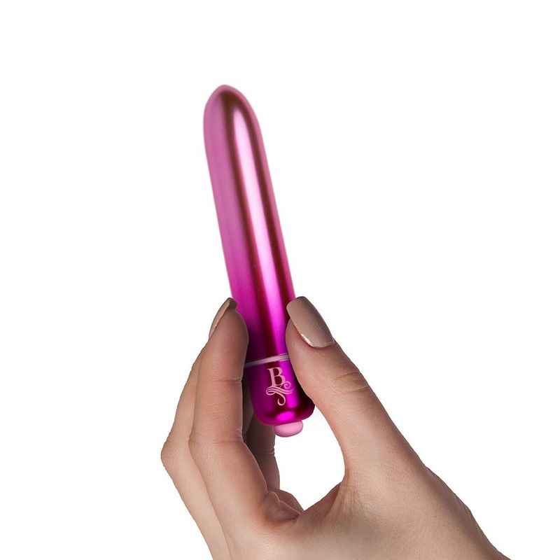 Hand holding a pink Boudoir Bullet, a waterproof bullet vibrator with 10 speeds for precision stimulation.
