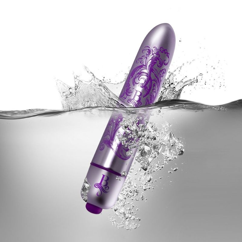 discreet waterproof bullet vibrator submerged in water with splashes, showcasing its sleek design and functionality.