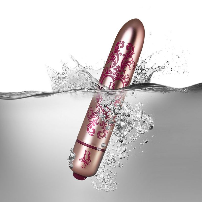 Boudoir Promenade Bullet, a waterproof bullet vibrator in pink design, splashing in water, showcasing its powerful features.