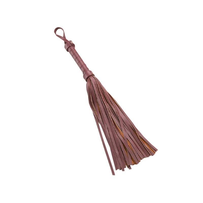 Silky suede flogger from the 8 Pc Deluxe Bondage Play Kit Burgundy Gold, perfect for soft erotic play.