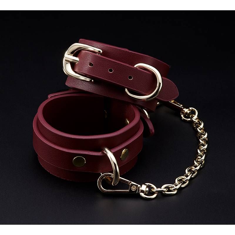 8 Pc Deluxe Bondage Play Kit Burgundy Gold wrist restraints with gold chains and premium faux leather.