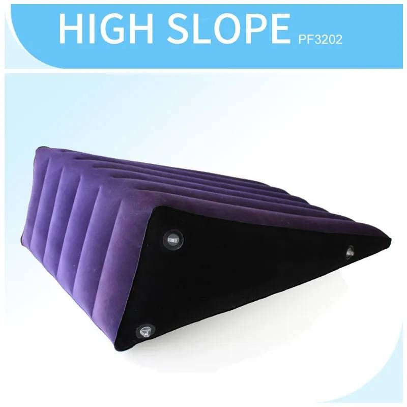 Large inflatable sex positioning wedge cushion in purple and black with a high slope design.