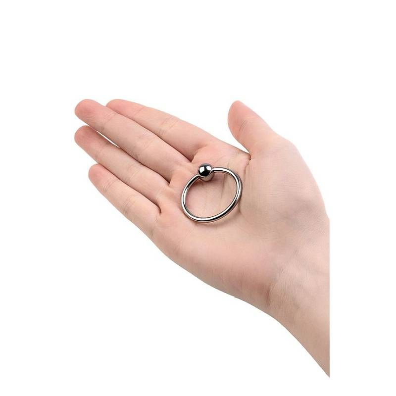 30mm metal penis head ring held in hand, showcasing the closed design and stimulating bead feature.