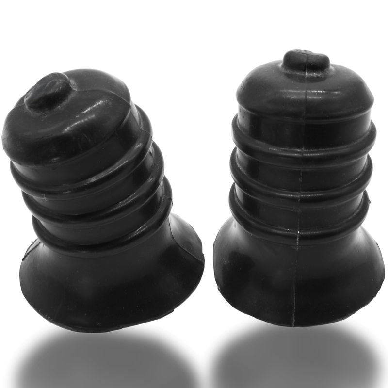 Ribbed silicone nip suckers in deep black color, featuring a curved design and flange base for secure fit during play.