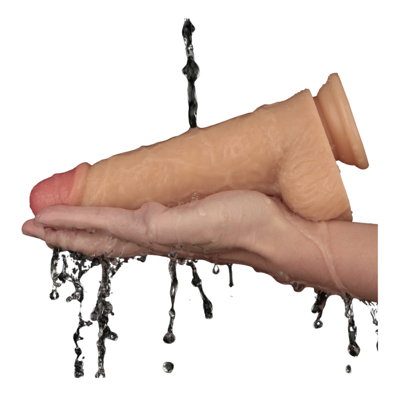 9in Vibrating USB Power Basics Cock in hand, demonstrating waterproof feature and realistic design, vibrating realistic dildo