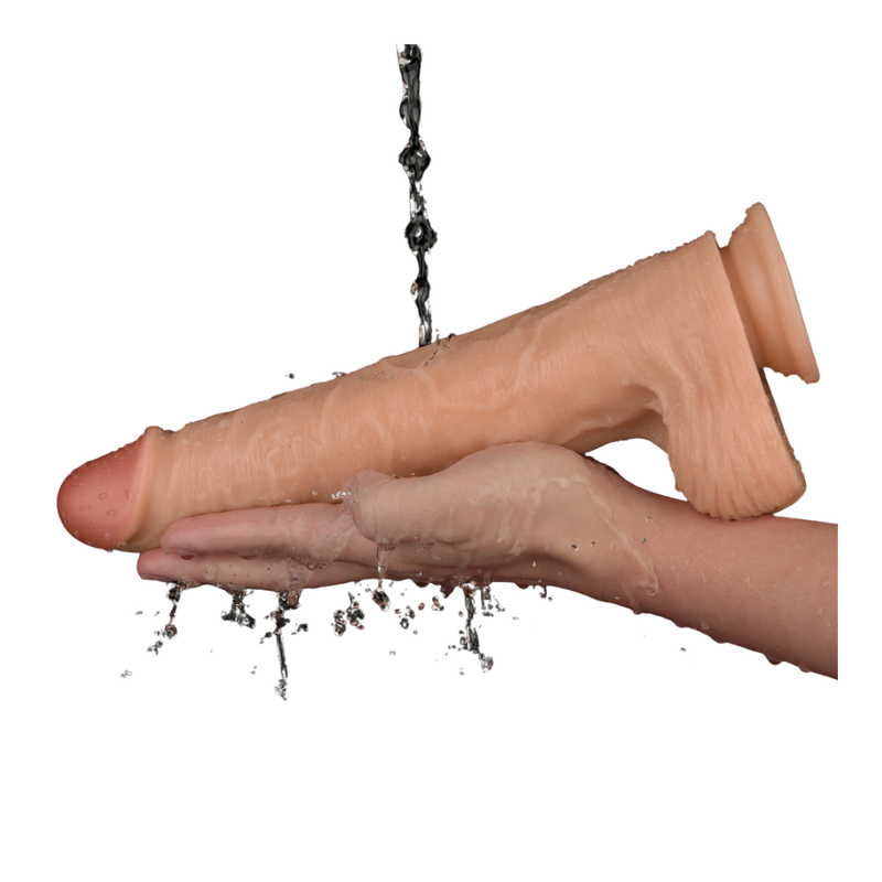 11in Vibrating USB Power Basics Cock in hand under water, showcasing the realistic texture of the vibrating realistic dildo.