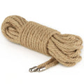 Rustic hemp bondage rope coiled neatly, showcasing its robust texture and tactile grip for traditional bondage.