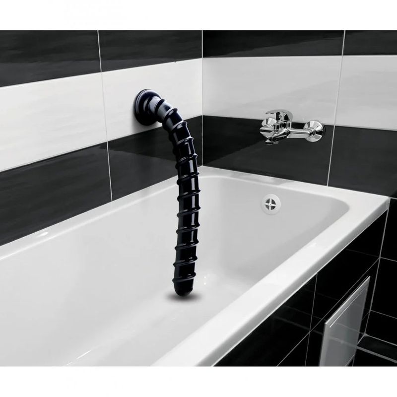 Hosed 18in swirl thick anal snake in a modern bathtub setting, showcasing its swirled ridges.