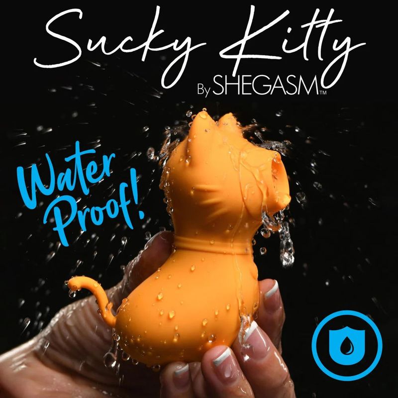 Sucky Kitty 7X clitoral stimulator with suction in orange, showcasing waterproof features in splash setting.