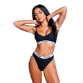 Playboy bunny 2-piece set in black featuring athletic mesh bralette and high-cut thong with Playboy logo.
