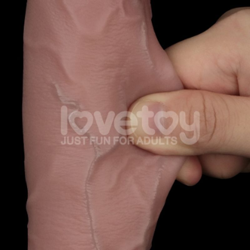Close-up of a person squeezing a dual layer silicone dong, showcasing its realistic texture and flexibility.