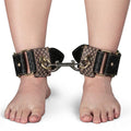 Faux leather ankle cuffs featuring padded fit and metallic hardware, ideal for restraint and comfort.