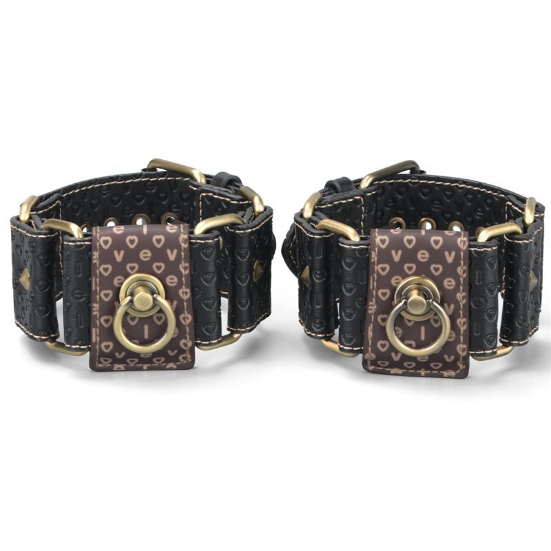 Rebellion Reign Hogtie Set handcuffs in black leather with vintage bronze accents for bondage play.