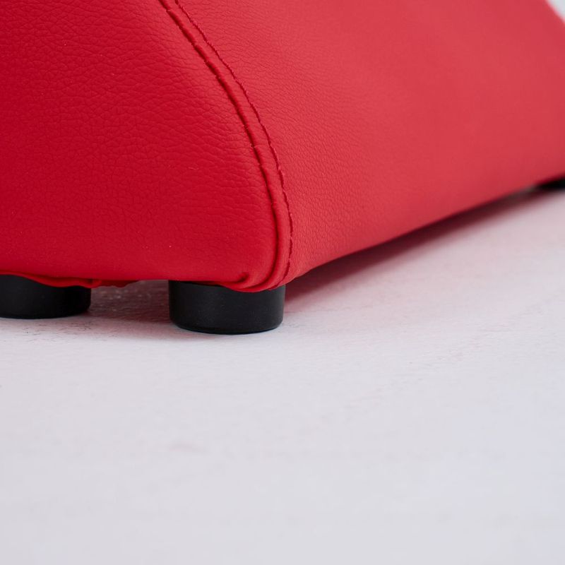 Close-up of the Kama Sutra love lounge in red, showcasing its ergonomic curves and textured surface.