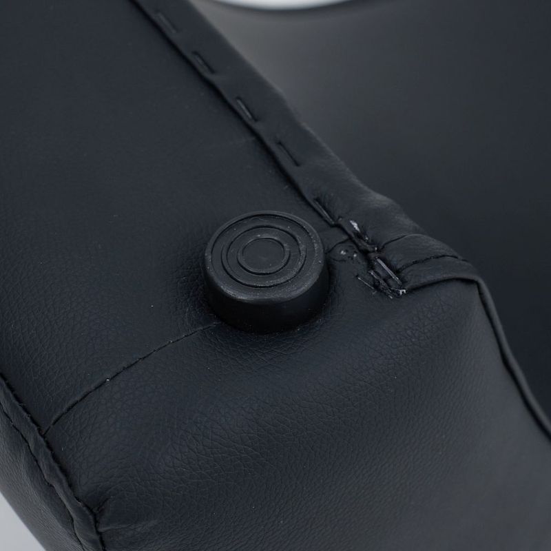 Close-up of the Kama Sutra love lounge's ergonomic button detail, showcasing its sleek black design and craftsmanship.