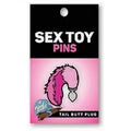 Tail Butt Plug Enamel Pin displayed on packaging featuring the playful design of a tail butt plug.