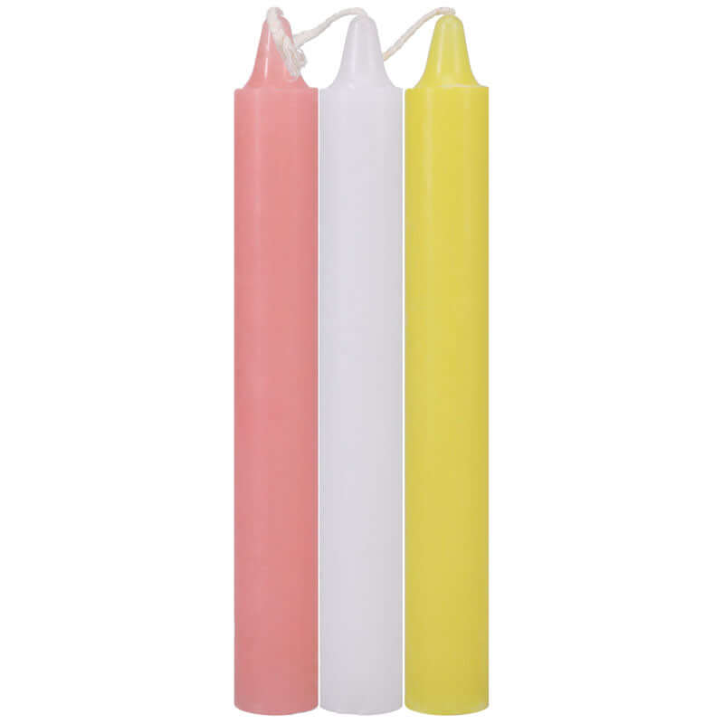Japanese drip candles for wax play in pink, white, and yellow colors for sensation play.