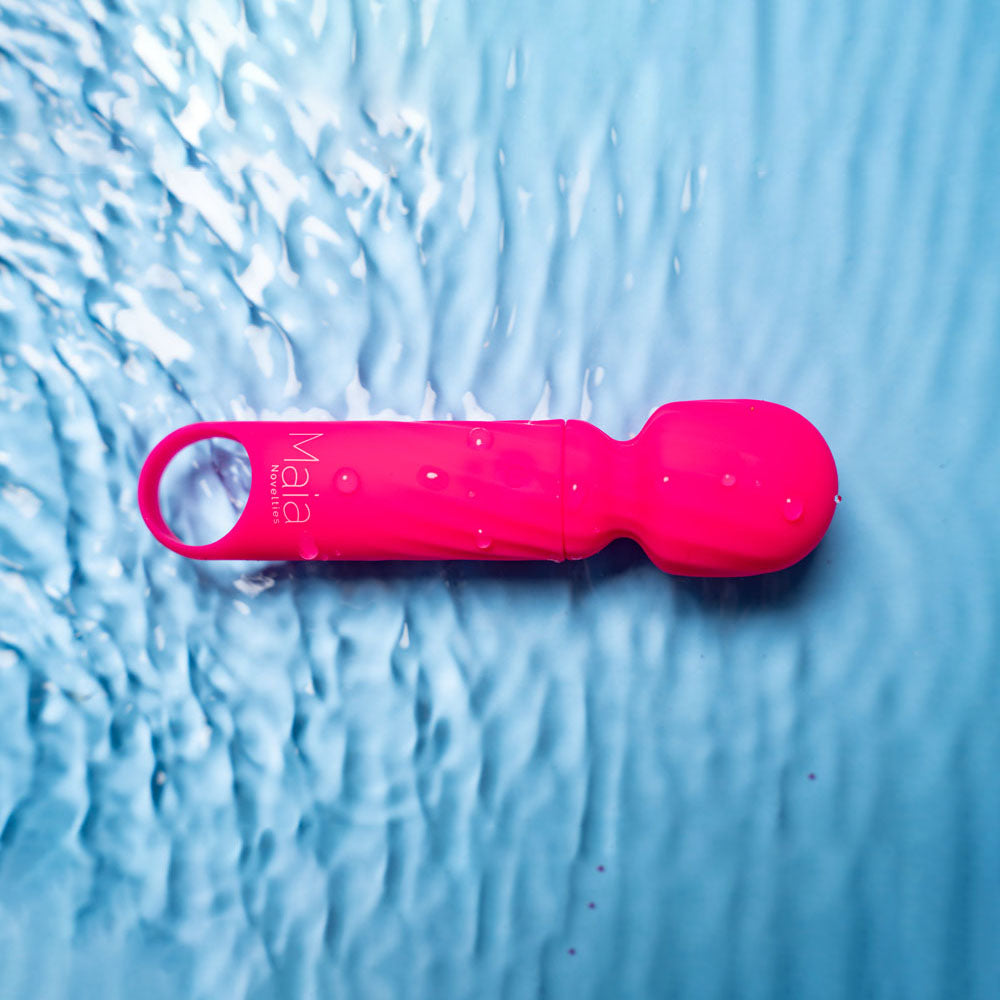 Maia DOLLY -  -  12.7 cm USB Rechargeable Massage Wand on a water surface for an intimate experience.
