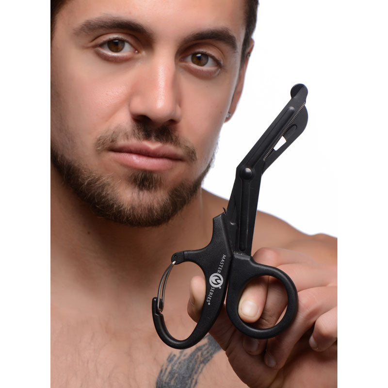 Master Series Snip -  Heavy Duty Bondage Scissors held by a man, showcasing durable blades and carabiner handle.