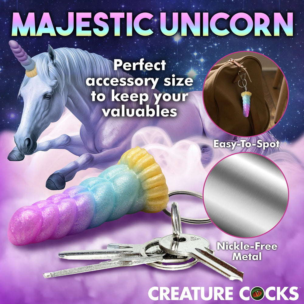 Creature Cocks Mystique Unicorn Keychain - Novelty Fantasy Dildo Keyring accessory with keys and unicorn backdrop.