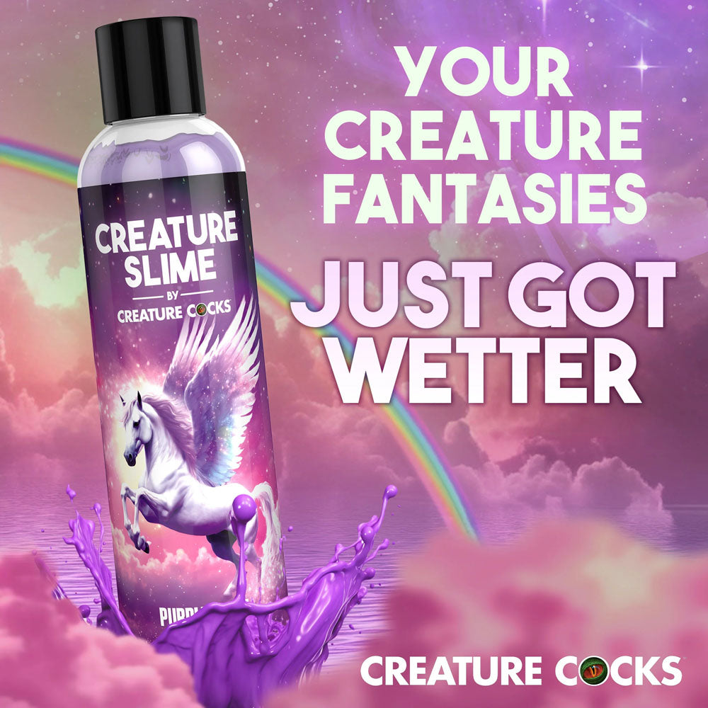 Creature Slime by Creature Cocks -  Slime -  Water Based Lubricant - 237 ml Bottle on a colorful background with a unicorn.