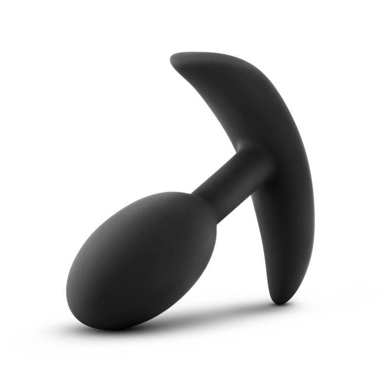 Anal Adventures Platinum Vibra Slim Plug -  8.9 cm Small Butt Plug with Internal Ball on a smooth surface.
