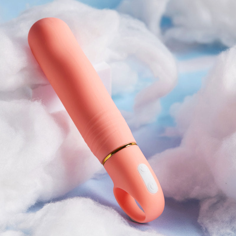 Aria Smokin' AF - Coral 15.2 cm Vibrator lying on soft clouds, showcasing its elegant design and features.