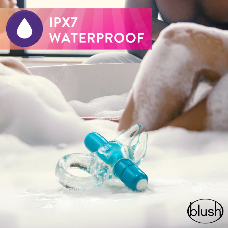 Play With Me Bull Vibrating C-Ring - Clear/ Vibrating Cock Ring in a bathtub, showcasing soft rabbit ears and waterproof design.