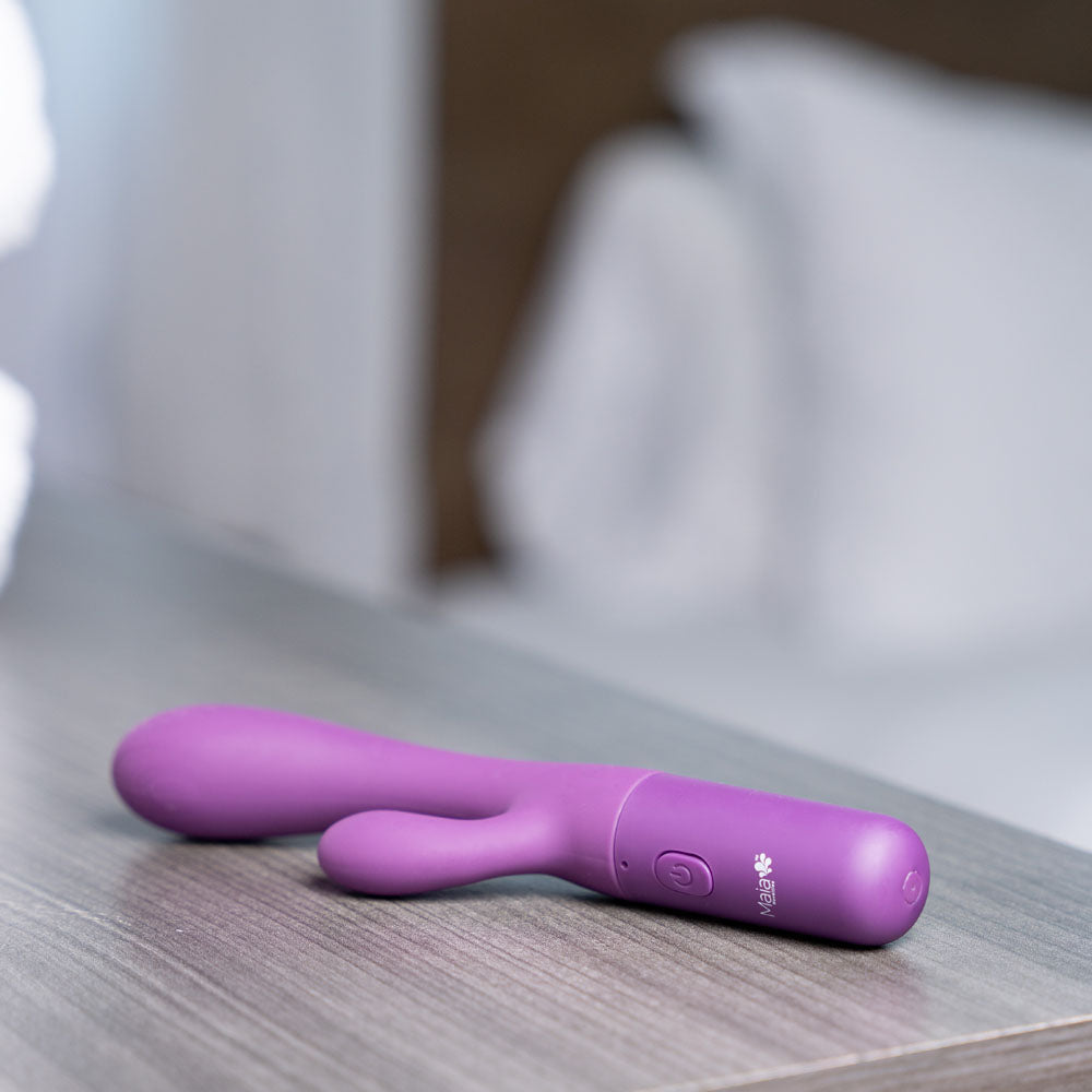 Maia RAYLA -  17.8 cm USB Rechargeable Rabbit Vibrator resting on a wooden table with a soft background.