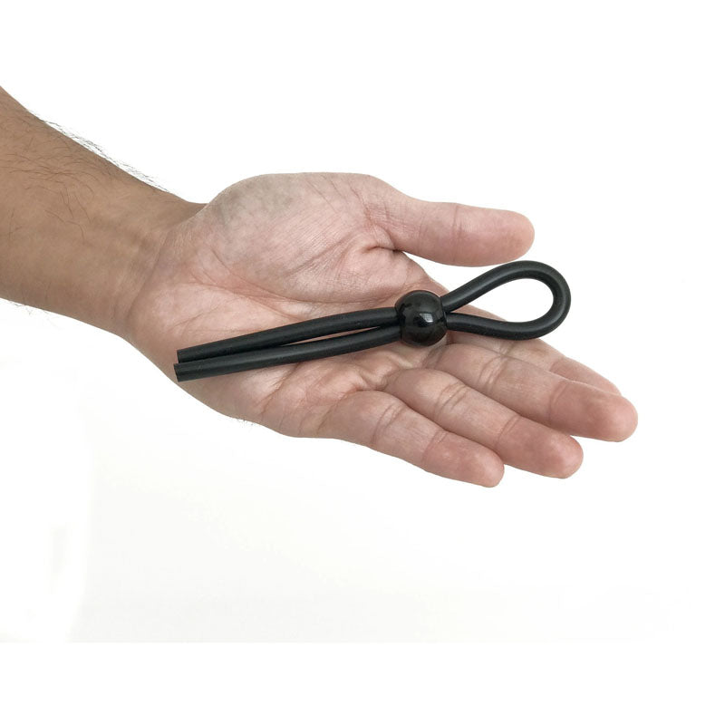 Boneyard Cock Leash Single -  Adjustable Cock Lasso Ring held in a hand, made from medical grade silicone.