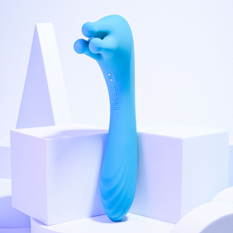 Evolved HEADS OR TAILS - Blue 19.3 cm USB Rechargeable Dual Ended Massager on white geometric background.