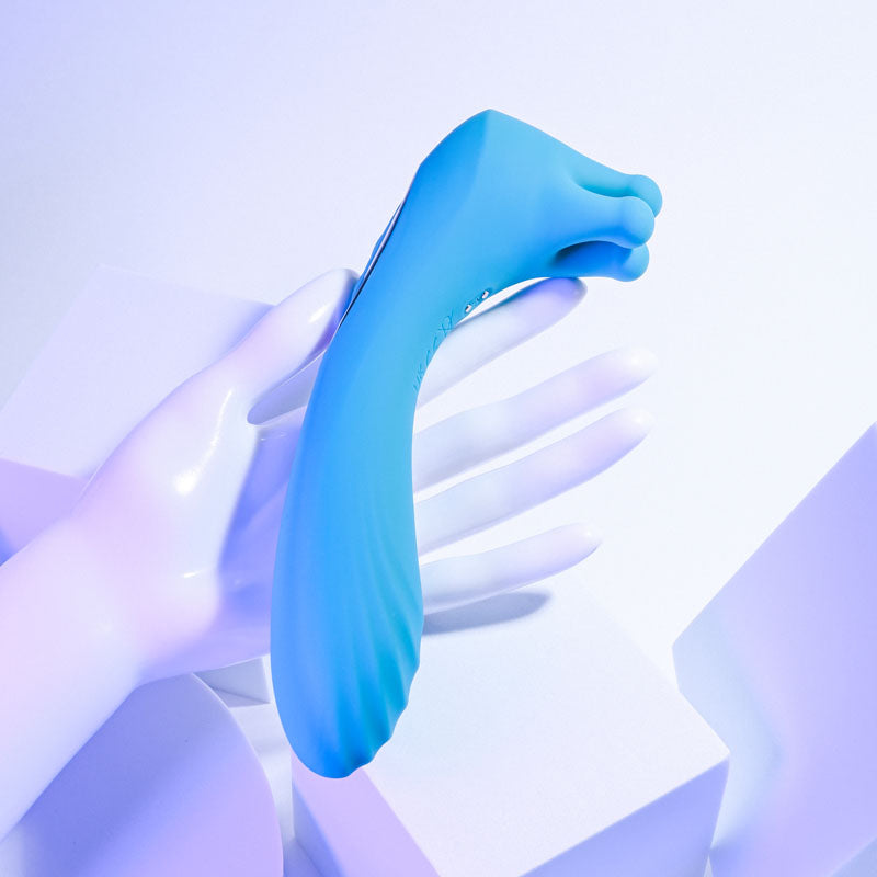 Evolved HEADS OR TAILS - Blue 19.3 cm USB Rechargeable Dual Ended Massager in a hand, showcasing its unique design and features.