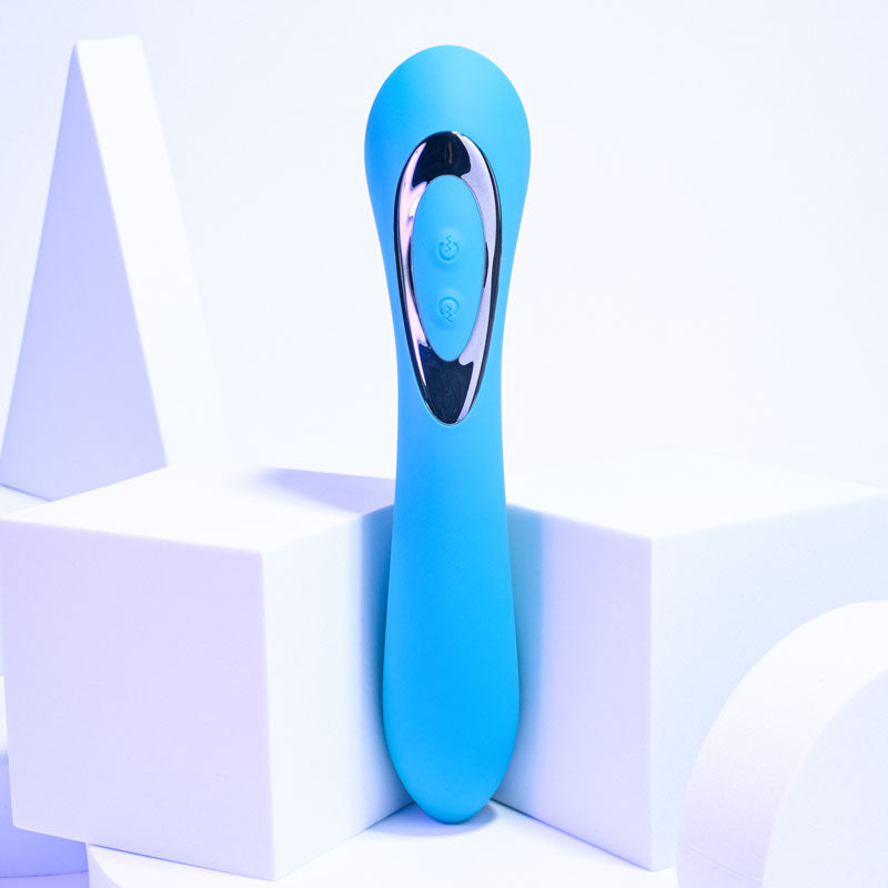 Evolved HEADS OR TAILS - Blue 19.3 cm USB Rechargeable Dual Ended Massager on geometric background.