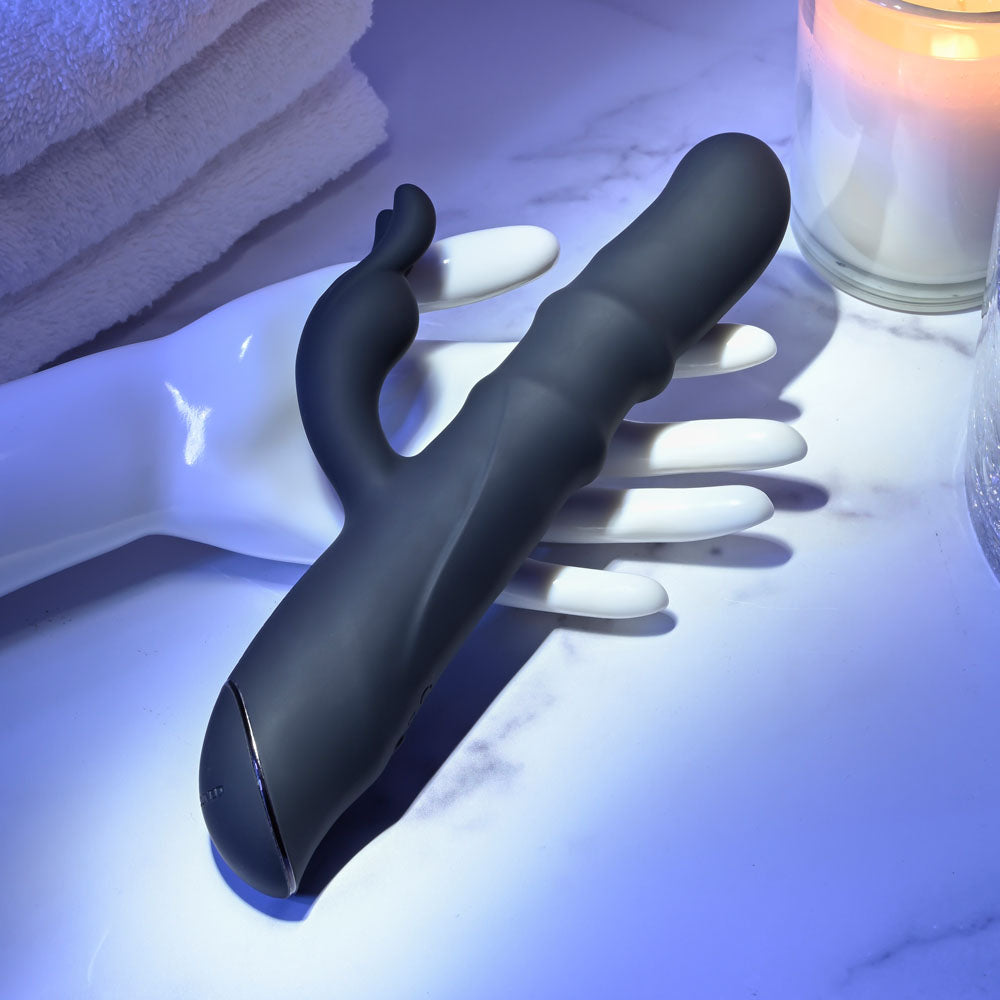 Evolved RINGMASTER - 23.1 cm USB Rechargeable Rabbit Vibrator displayed on a hand, showcasing its sleek design and features.