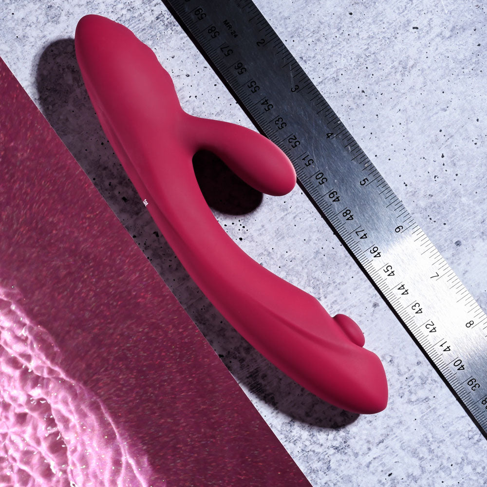 Evolved JAMMIN' G - Burgundy 20.1 cm USB Rechargeable Rabbit Vibrator placed next to a ruler for size reference.