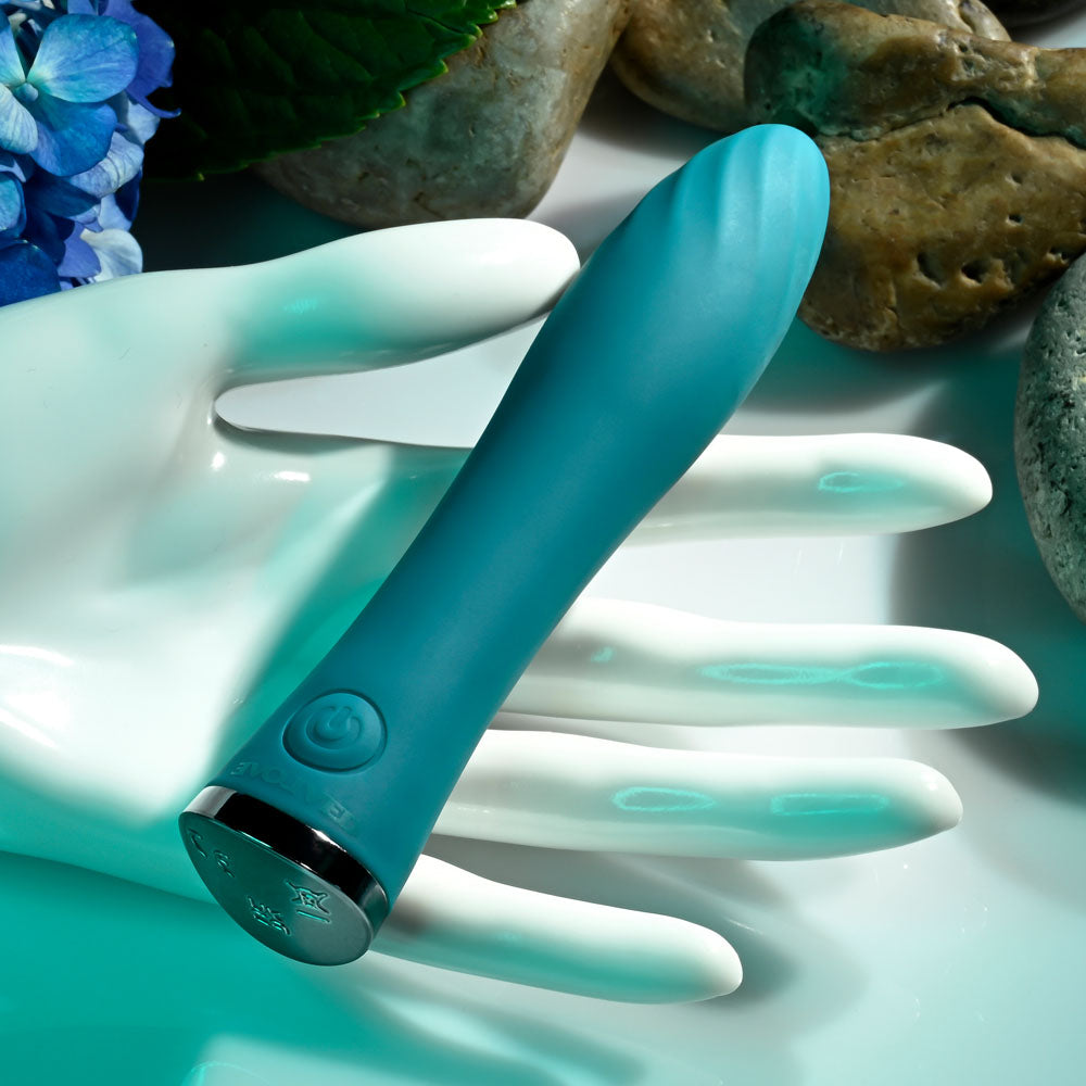 Evolved ULTRA WAVE - 13 cm USB Rechargeable Mini Vibrator displayed on a hand, showcasing its sleek design and control features.