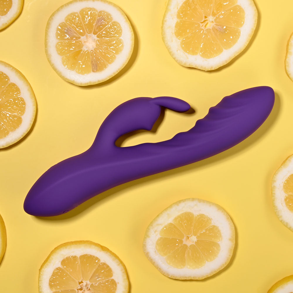 Evolved WAVY RABBIT - 20.6 cm USB Rechargeable Rabbit Vibrator on a yellow background with lemon slices.